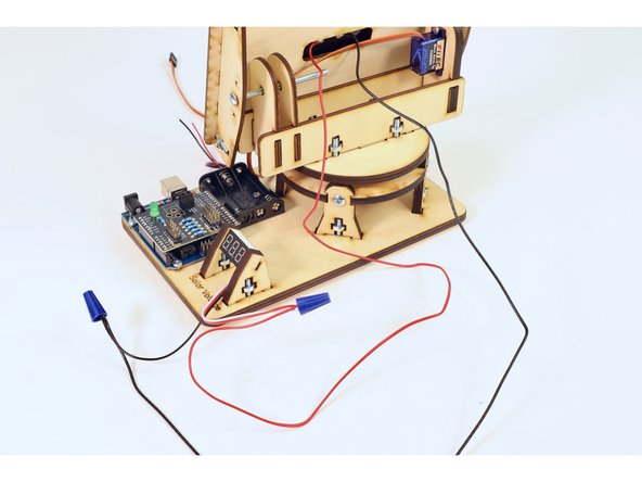Twist the other wire nut onto the red/white wire bundle.