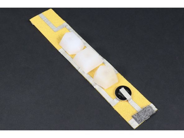 Your bracelet is now complete! To complete the circuit and turn the bracelet on, simply connect the conductive hook and loop.