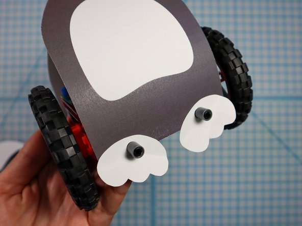 First, put the pin through the foot, then through the penguin body, then into the Rover body.