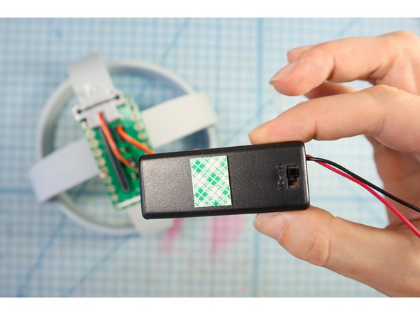 Use foam mounting tape to secure the battery pack.