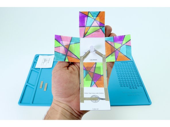 Peel and stick the paths shown in photo 1. This should leave you with two sections of Maker Tape.