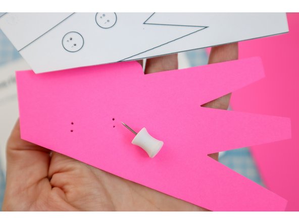 Use the template and a push pin to poke holes for the LED legs.