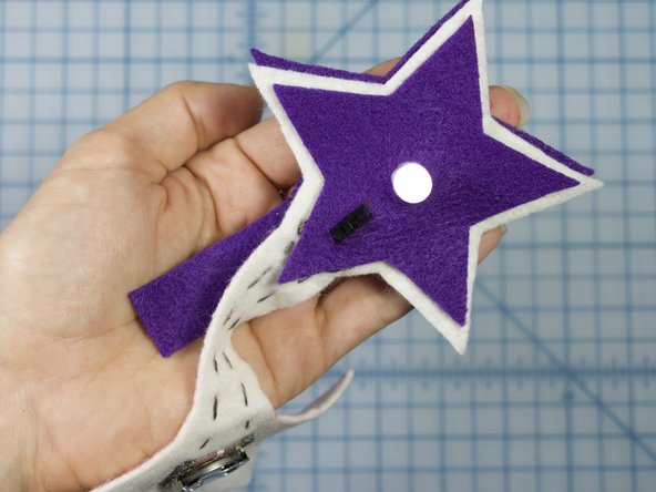 Place the interior star underneath the main star