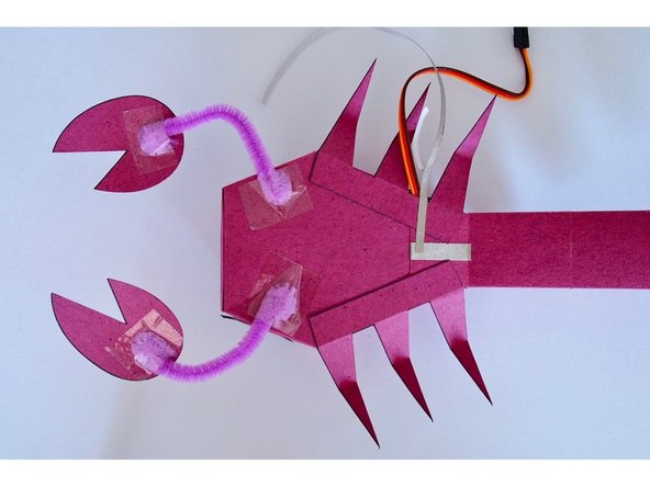 Connect the Maker Tape on the bottom of ScorpioBot to Pin 0 on the Bit Board with a piece of 1/8&quot; wide Maker Tape.