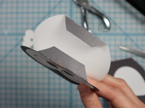 Fold along the dotted lines as shown.