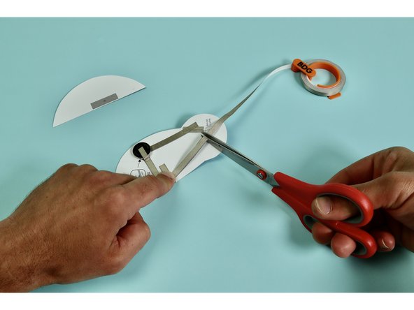 Measure, cut, peel, and stick a piece of Maker Tape down as indicated atop the letter 'F.'