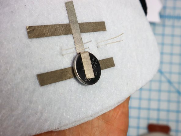 Insert each LED through the holes with the longer, positive leg in the top hole.