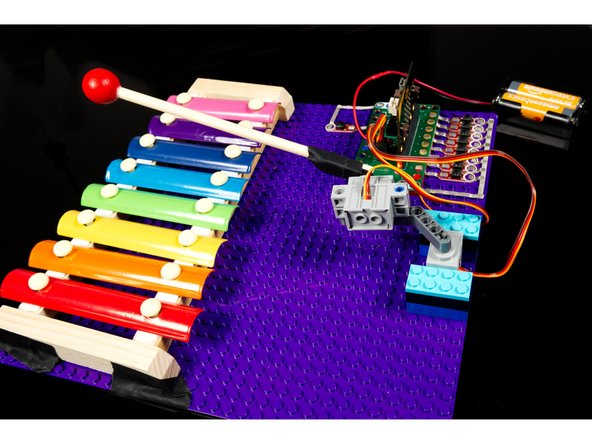 We taped out xylophone down to the LEGO baseplate once we found the optimal position for it.