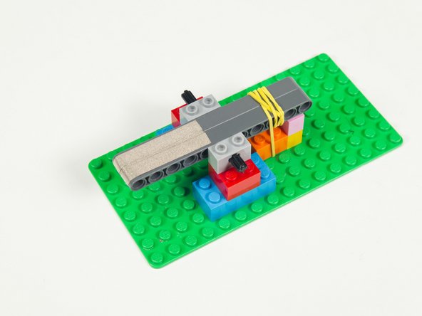 Add two more strips of Maker Tape, again leaving enough at the end to wrap around to the bottom of the beams.