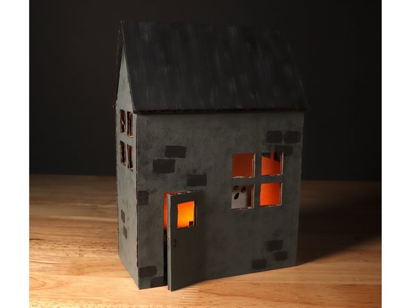 Use paint, markers, or colored pencils to decorate your Haunted House!