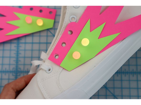 Unlace the shoes, then lace the shoes back up through the holes.