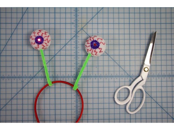 Twist the other ends of the pipe cleaners around the headband.