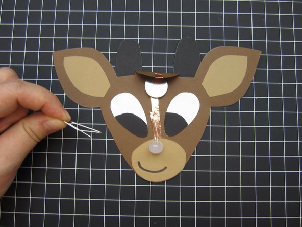 Use a binder clip or paper clip to hold the battery holder together.