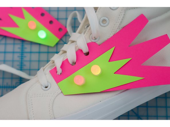 Unlace the shoes, then lace the shoes back up through the holes.