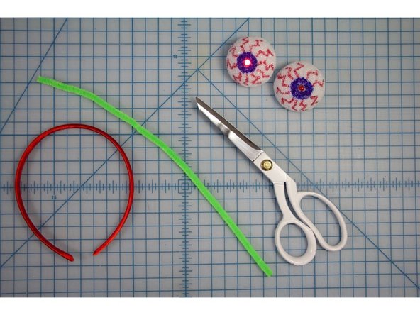 Choose a pipe cleaner to be the sticks of the eyes.