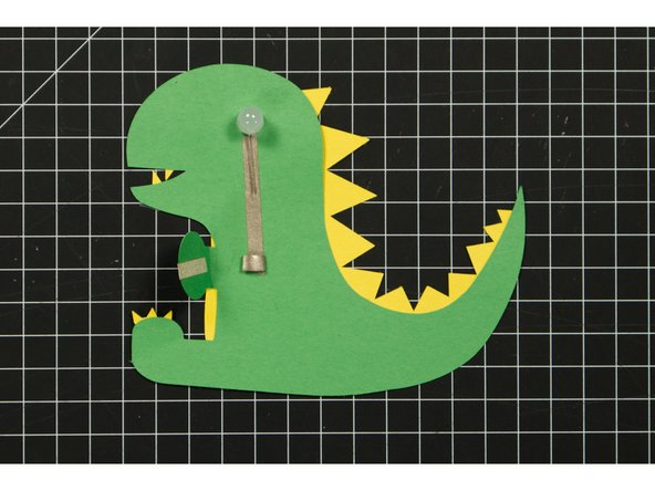 Since Maker Tape is conductive on both sides you can use it to make a tape loop that helps hold your battery in place.