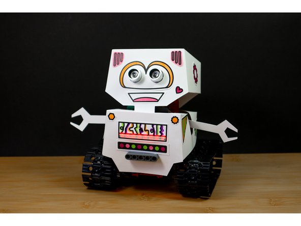 If you haven't already, add batteries by opening up the paper body from the back.