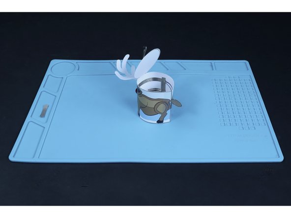 Add a final dot of hot glue to the striped area for the tail and press the  striped part of the tail into place.