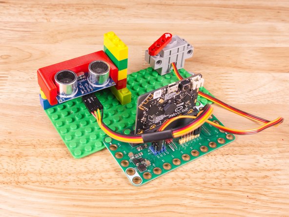Plug the three-wire connector of the Crazy Circuits Ribbon Cable into the row with Pin 13 on the Bit Board. The wire colors should match the pin header colors, with S1 (yellow) going to the yellow pin.