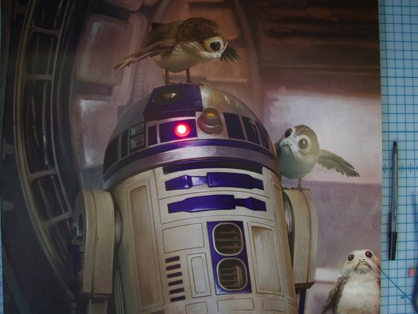 Test your switch by squeezing the poster board where the switch is located. You should see a light!