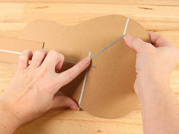 Wrap the Maker Tape around to the back of the guitar and connect it to the ground path, using more Maker Tape if needed.