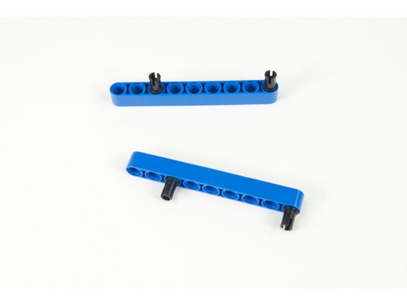 Assembled pins and beams as shown. One pin should go in the third hole at one end, and the last hole at the other end.