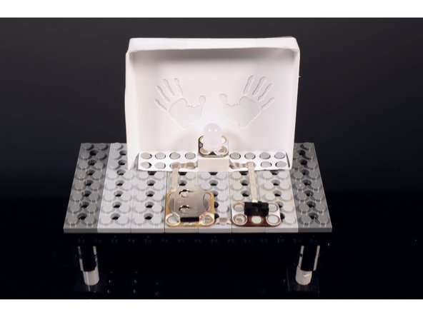 To finish the circuit, press a single Crazy Circuits slide switch into place where shown. Again, take care to orient the part so that it matches the circuit diagram.
