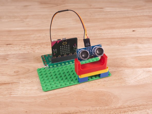 Alternately you can use some LEGO bricks and a rubber band or tape to hold the sensor in place. (But don't use anything conductive!)