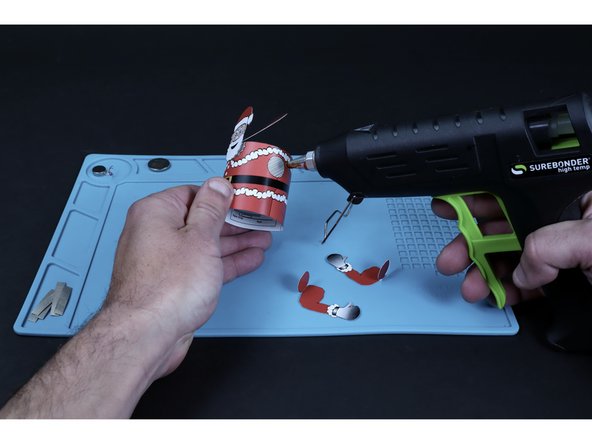 Do the same for each of Santa's arms (It may be helpful to fold the connector circles and line them up with the tube body first).