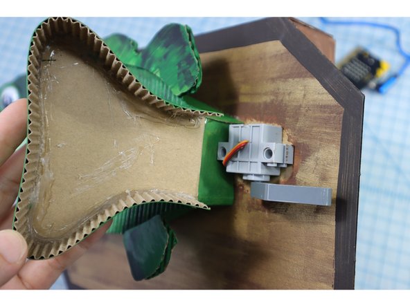 Use a twist tie and tape to connect the motorheads to the head and tail. This type of connection can be a bit loose to allow for some wiggle room in the angle of the motor's pull.