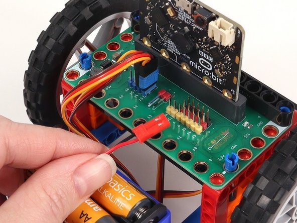 On the back of the Rover disconnect the battery pack and both servos from the Bit Board.