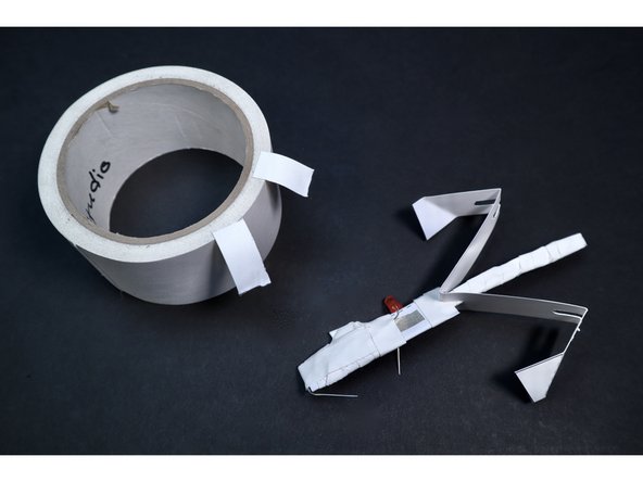 Prepare two small pieces of gaff/duct tape.