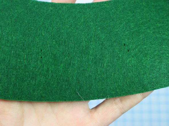 Use a push pin to make two holes for the LED's legs. When the push pin is inside the felt, rotate it around a bit to make the hole larger and easier to see.