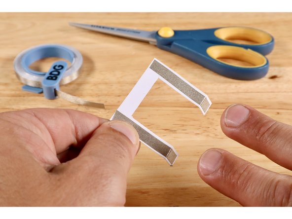 Fold the two dotted lines in the same direction.