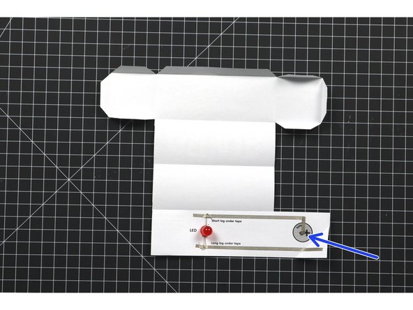 Add a tape loop using the Maker Tape to secure the battery down to the circuit.