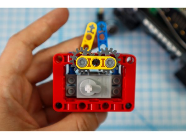 If you turn the gears so that the two half-height beams meet, they should be as symmetrical as possible. They won't be perfect but they should be close.