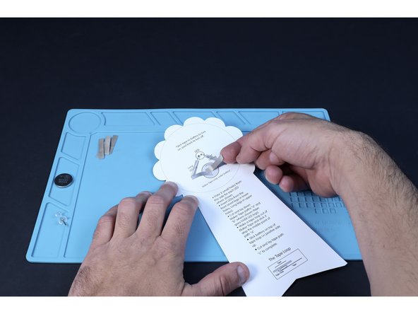 Peel and stick a Maker Tape path from atop the battery graphic right, toward the short leg path.