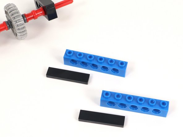 Add a 1x4 tile to the three studs on one end of a 1x6 brick with holes. You will need two of these.
