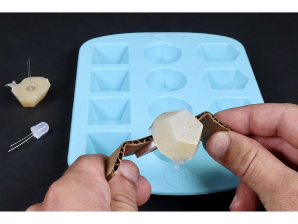 Attach a new LED to the cardboard/tape and make/remove a second jewel using the same process that you did for the first one.