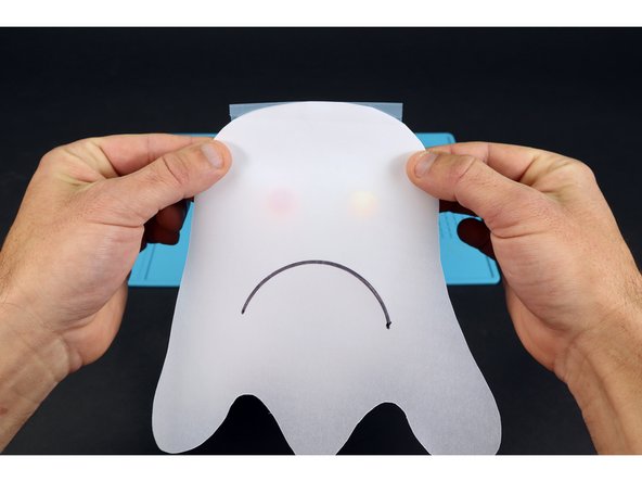 Lay the vellum ghost atop the circuit ghost and use a piece of transparent tape to connect the two layers at the top.