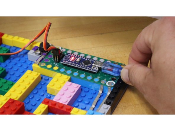Plug the Robotics Board into the computer using a USB cable.
