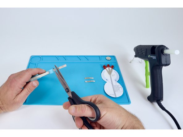 Use the circuit diagram to help you measure and cut three new pieces of Maker Tape for paths labeled "H,I,J".