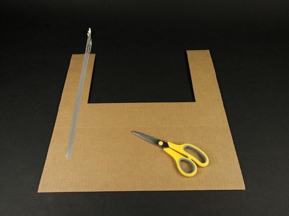 Run the tape up each side of the front piece as shown.