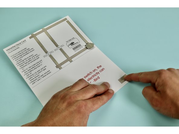 Your circuit is now finished. It will not turn on until or unless the card is closed and pinched where shown on the bottom right corner  of the front image. 
