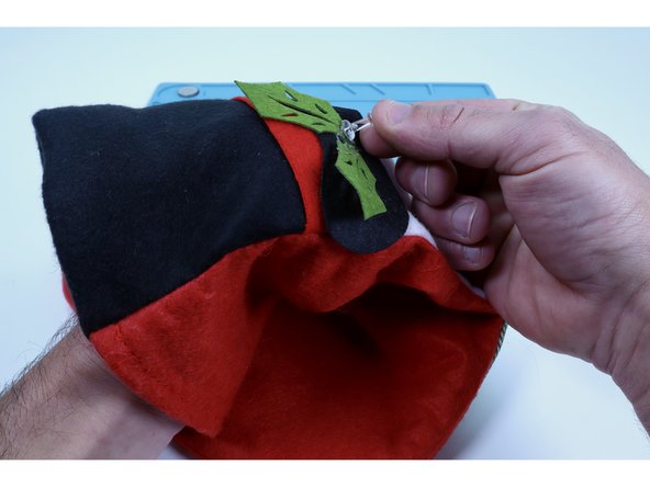 These accents are almost always held on by blobs of hot glue and may have several layers of material below THAT. For these reasons, use a push pin to make to make two &quot;pilot holes&quot; for each LED (6 TOTAL) through the material  where each accent was for the LED legs to be threaded through in the next step.