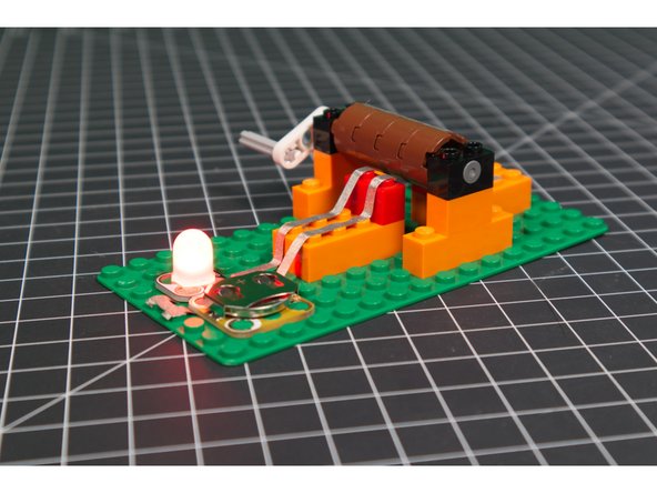 You can get the LED to blink on and off by turning the crank. Try turning it faster or slower to see how it affects the rate that the LED blinks.