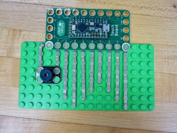 Clip your Invention Board over all the lines of tape.