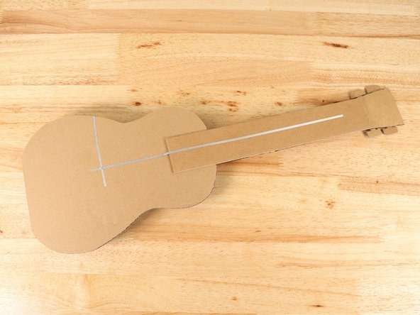 Add a long piece of Maker Tape that starts at the ground path and leads all the way up the neck.