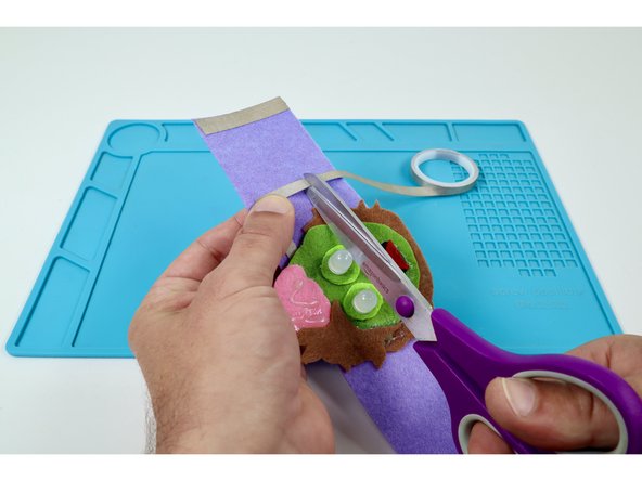 Measure, cut, peel, and stick two small Maker Tape paths as shown.  The goal is to create what is pictured in the last photo.