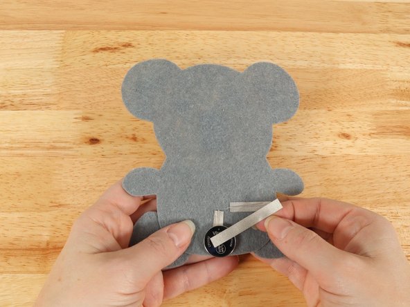 Add Maker Tape to connect the top (Positive) side of the battery to the Positive LED leg path.